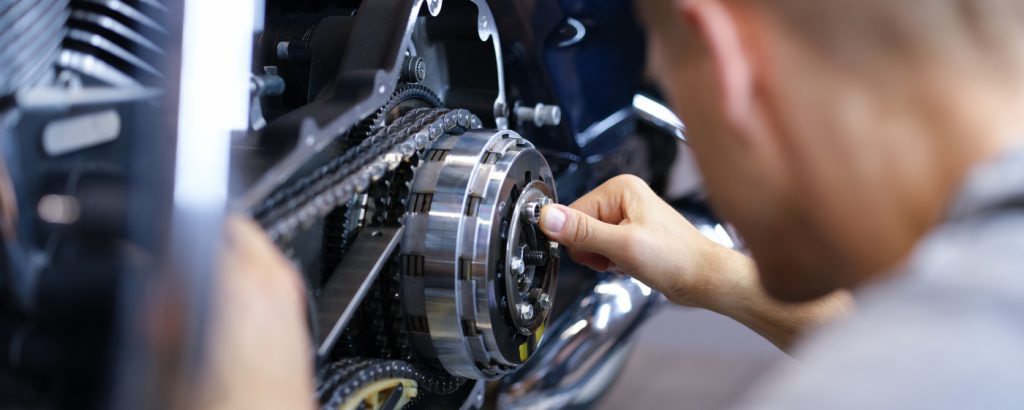 Mechanic checking the bike chain - Motorcycle Servicing Brixton